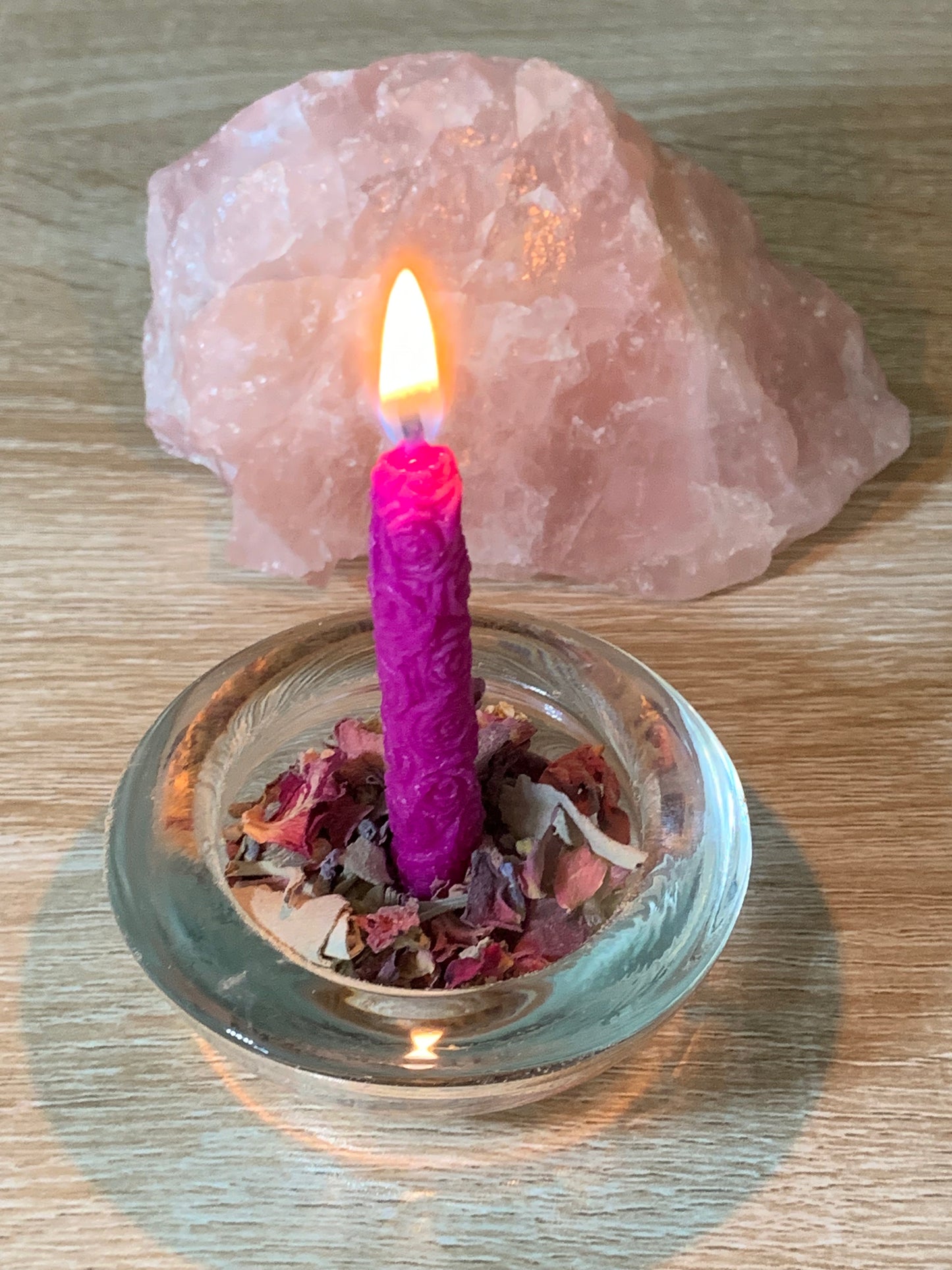 Candle and herb offering.